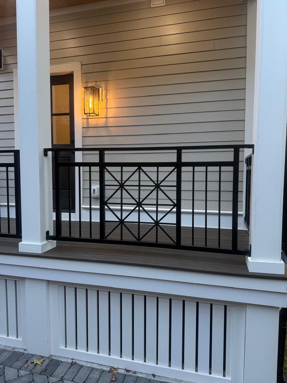 Porch railing with decorative steel panel