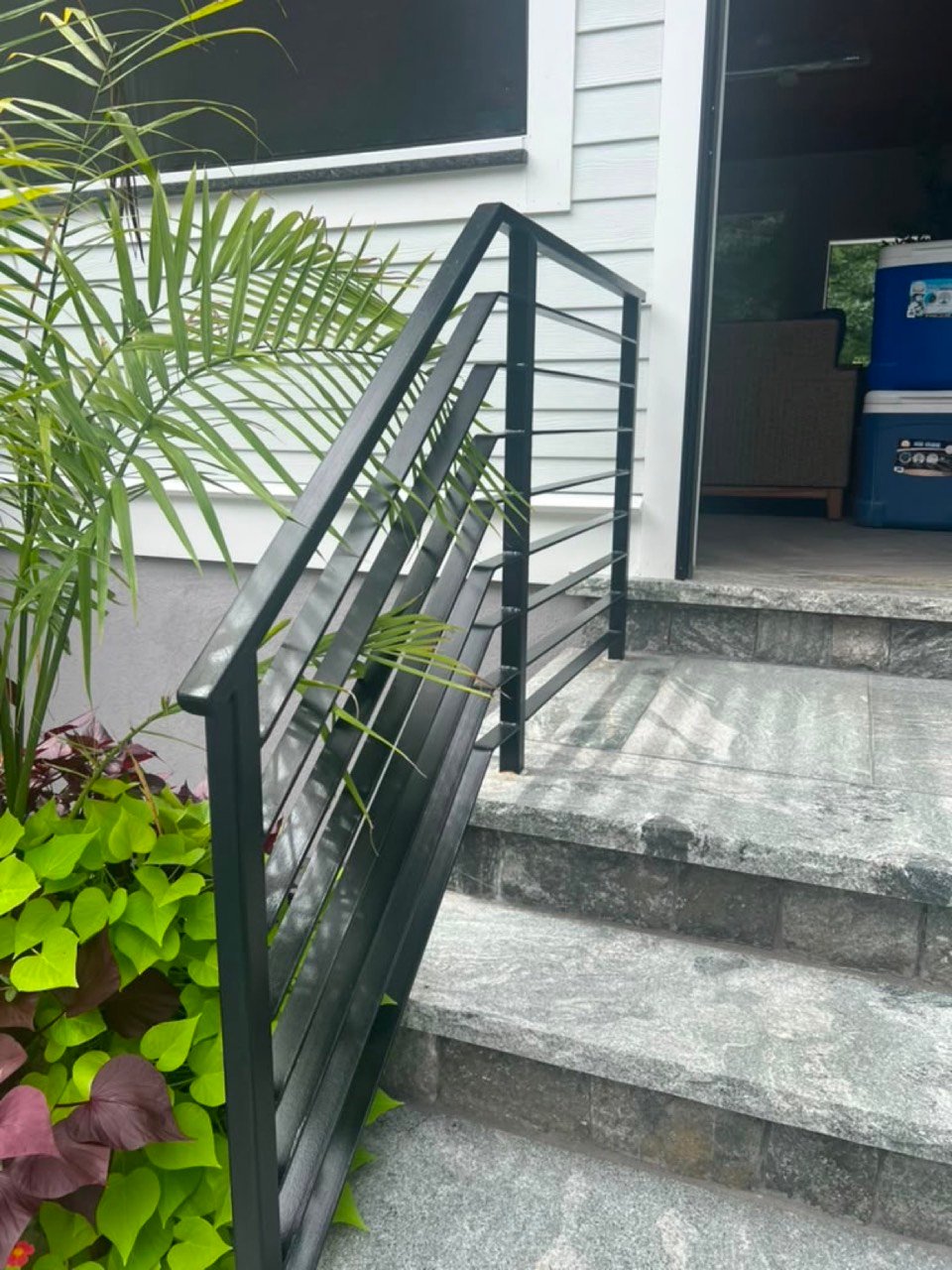 Steps with black steel handrail